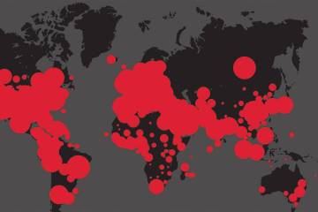 Red dots cover most of a black and gray map of the world