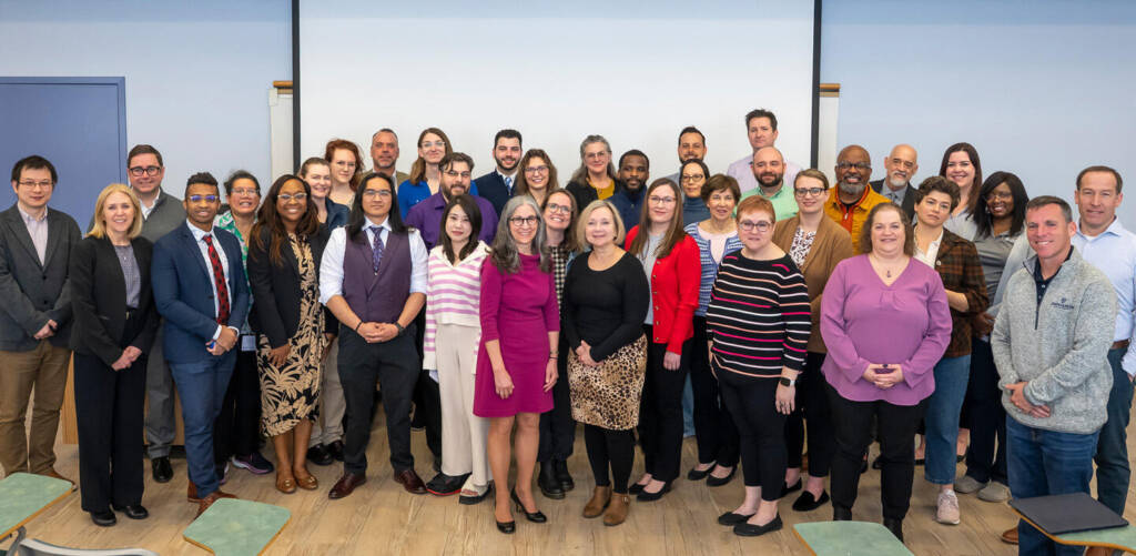 More than 20 members of the 2025 Johns Hopkins University Staff Advisory Council pose for a group photo.